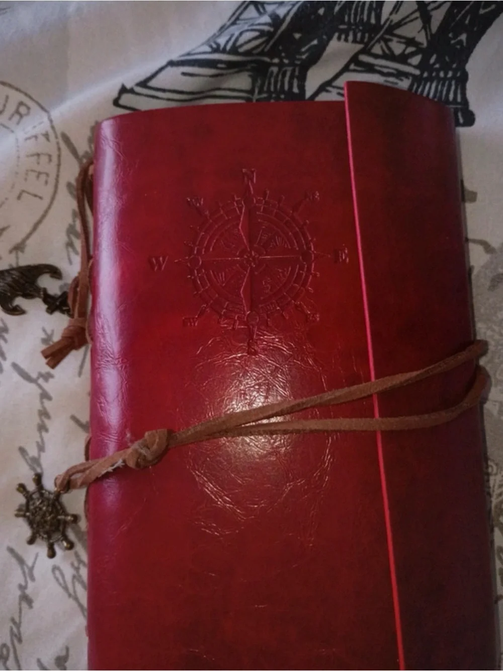 Burgundy Faux Leather Travel Journal Notebook with Compass Motif.